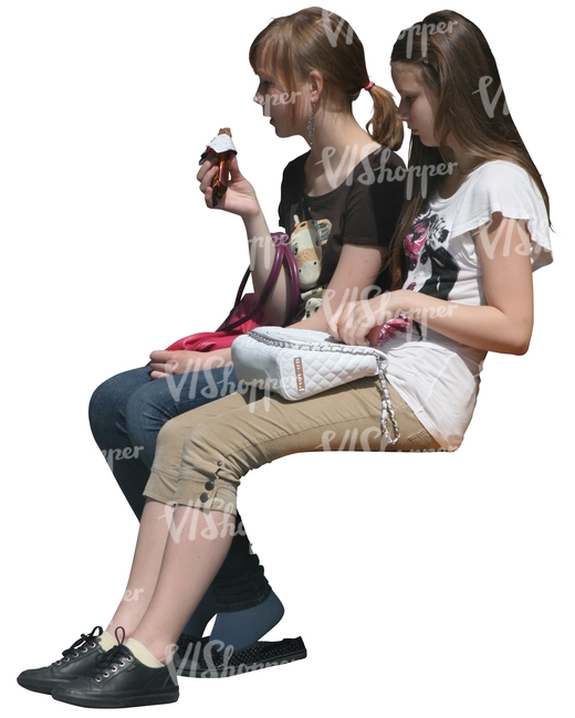 two cut out girls sitting and eating ice cream