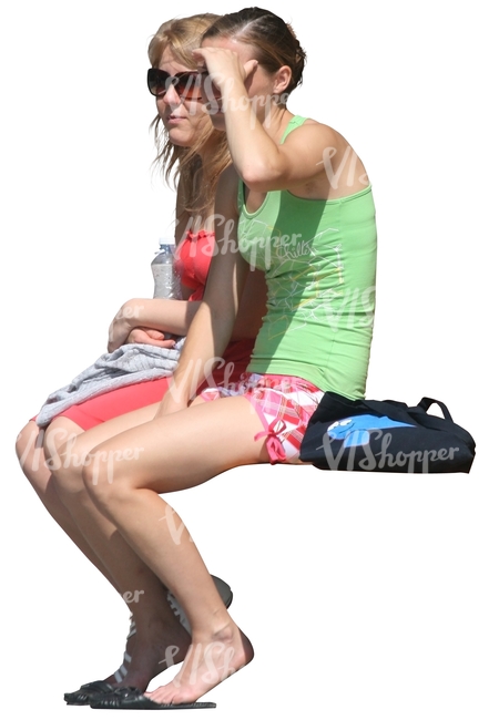 two cut out women sitting and looking at smth