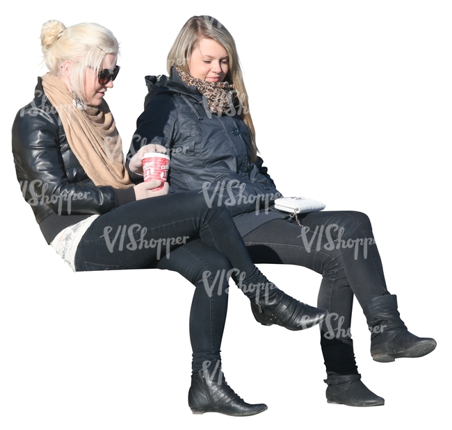 two women sitting and drinking coffee