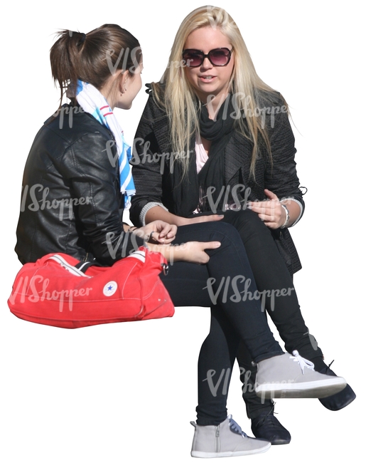 two cut out women sitting and talking