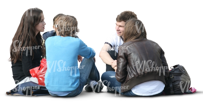 four cut out people sitting on the ground