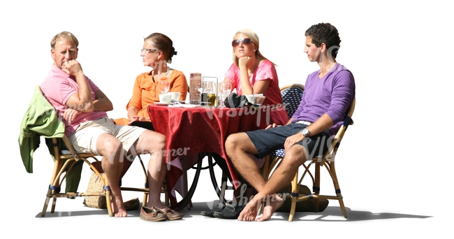 four people sitting in a street cafe