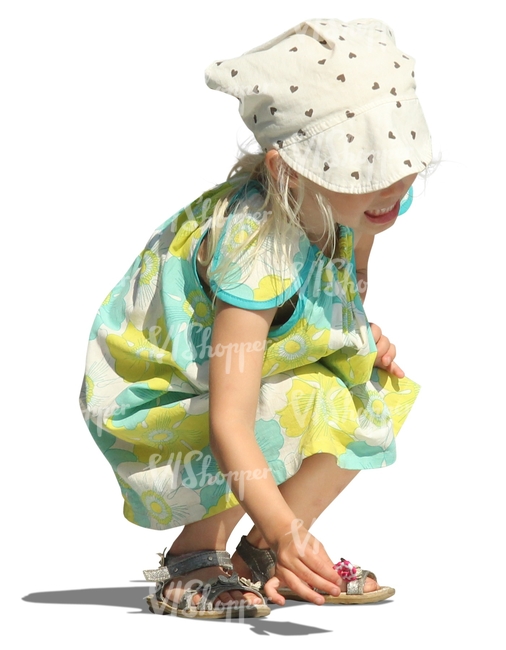 cut out girl in a summer dress squatting