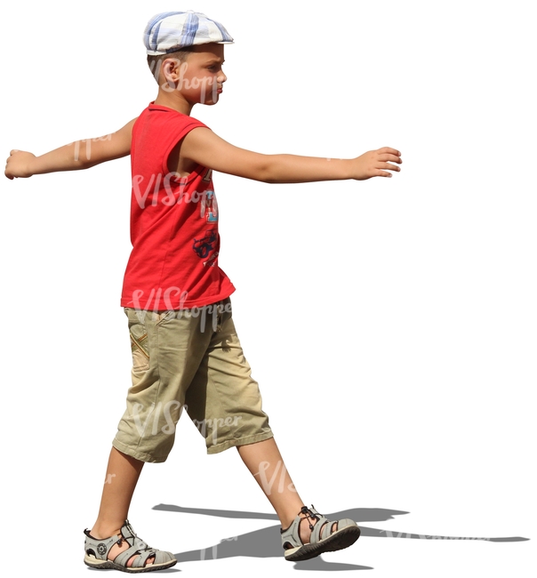 young boy with a hat walking arms apart