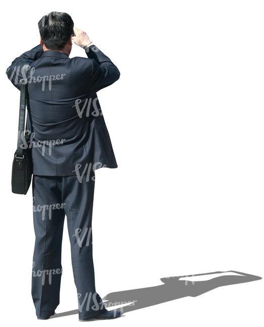 cut out asian businessman standing and taking a picture