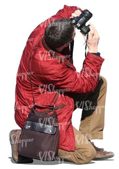 cut out man kneeling and taking a picture