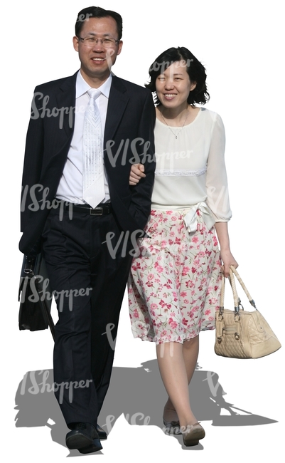 asian couple in formal clothes walking arm in arm