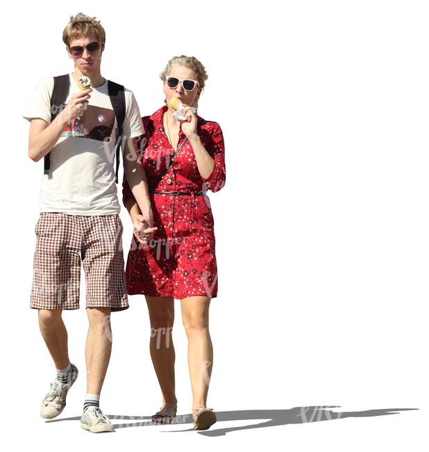 couple walking hand in hand and eating ice cream