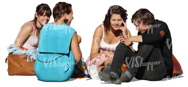 four people sitting on the ground