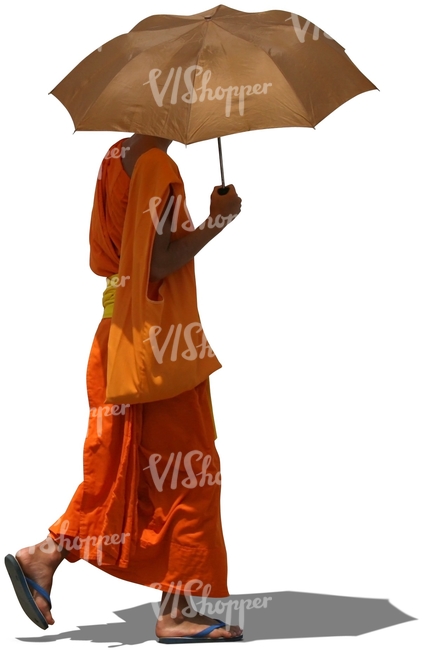 cut out buddhist monk walking with an umbrella