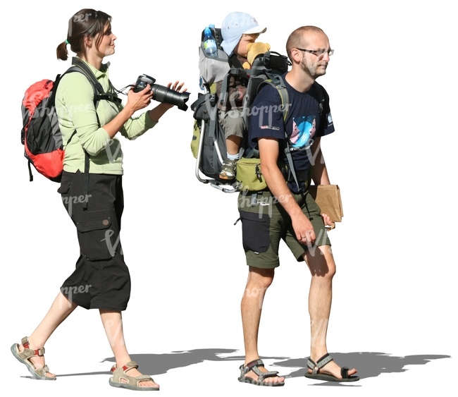 travelling family walking with backpacks