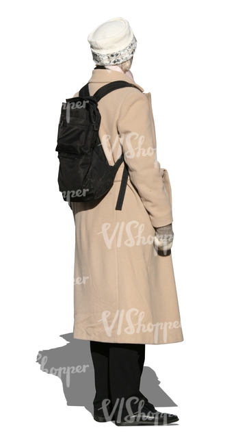 woman in a beige autumn coat standing