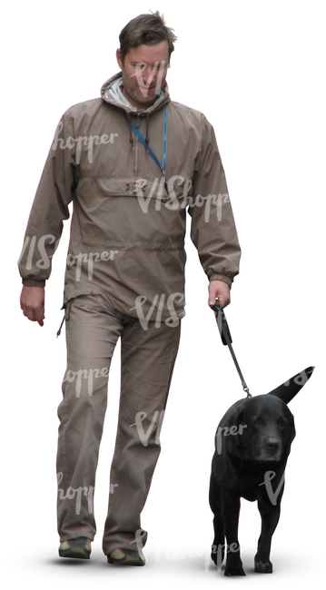 man walking a black dog