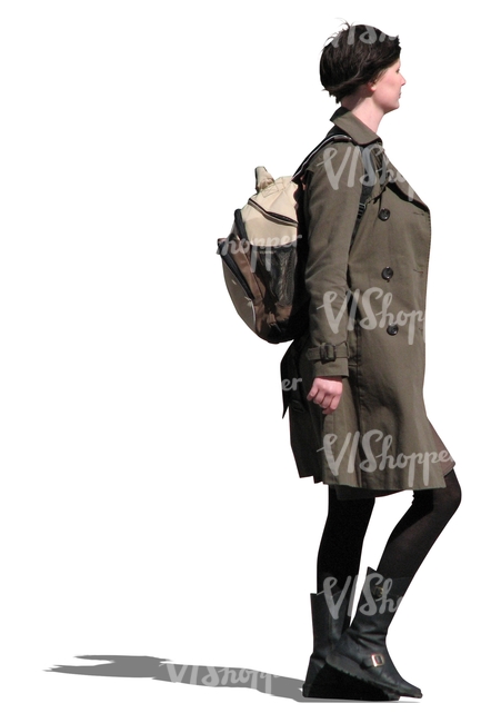 woman in a brown trench coat walking