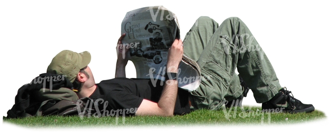 man lying on the grass and reading