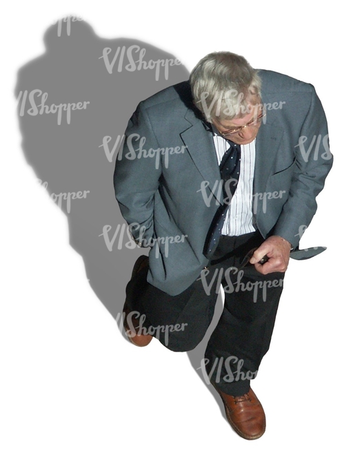 elderly man in a suit seen from above
