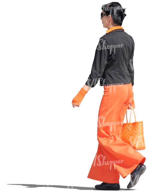 woman in a black and orange outfit walking