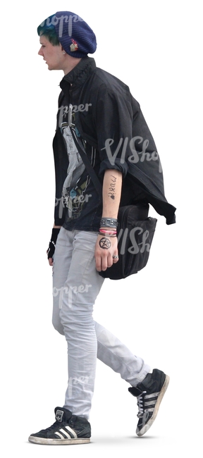 young man in punk style clothing walking