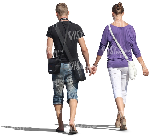 couple walking hand in hand seen from behind