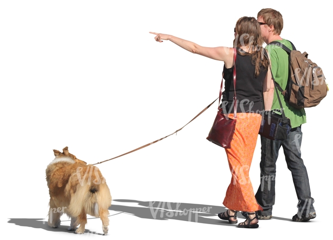 couple walking a dog and pointing at smth
