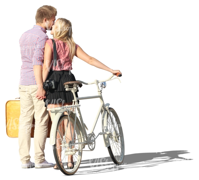 couple with a bike standing and kissing