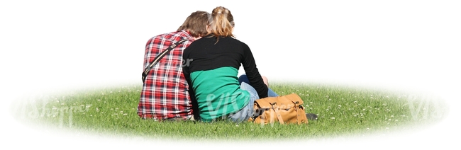 two people sitting together on the grass