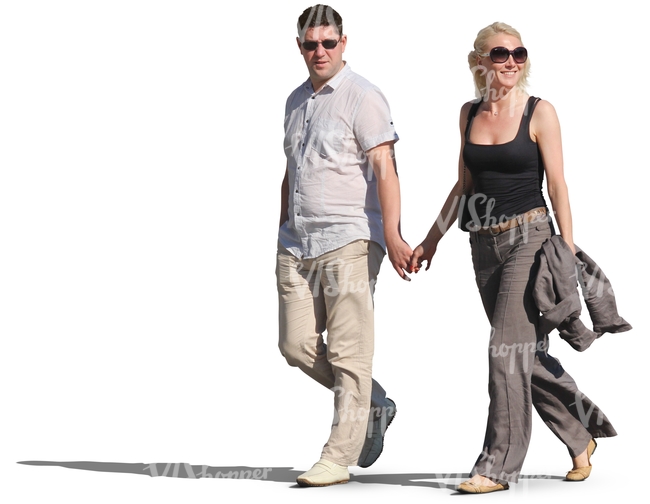 smiling couple walking hand in hand