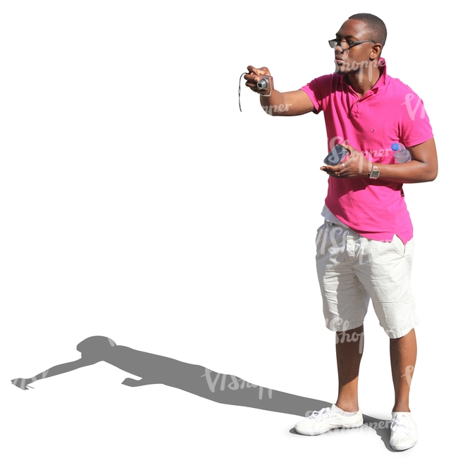 black man in shorts taking a picture