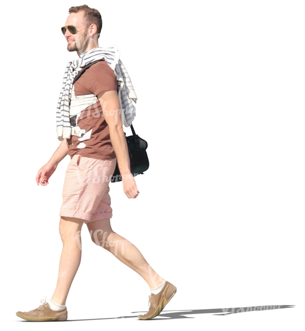 man in shorts walking happily
