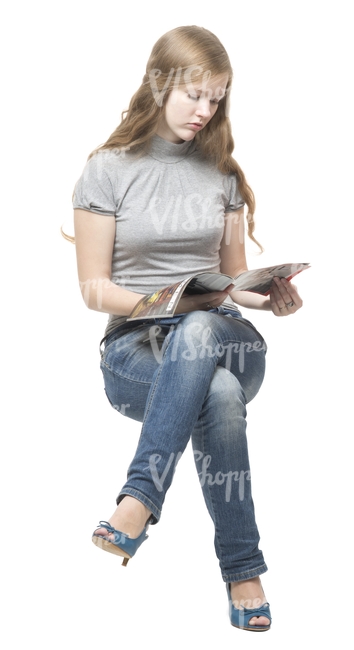 woman sitting and reading a newspaper