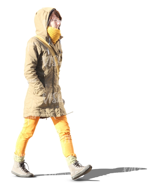 woman in yellow pants walking hands in her pocket