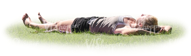 woman lying on her back in a park