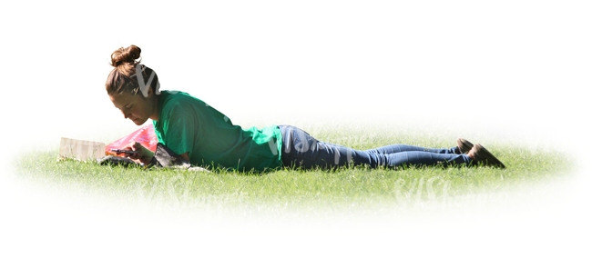 woman lying on the grass and reading a book