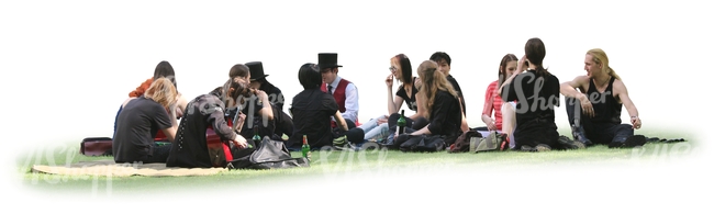 large group of people sitting together on the grass