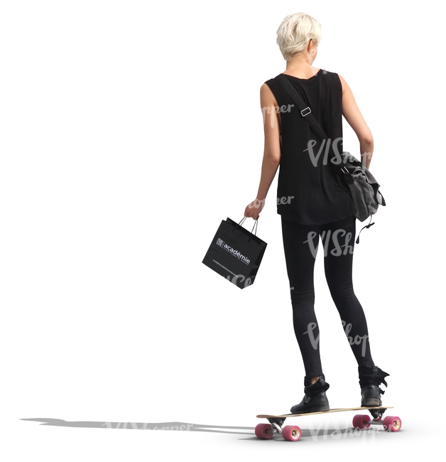 woman in a black outfit riding a skateboard