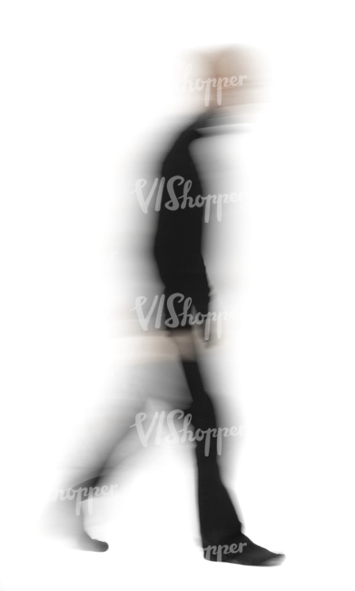 motion blur image of a man in black outfit walking