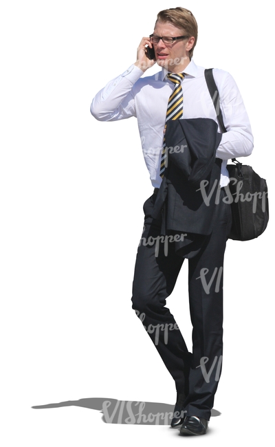 young businessman walking anf talking on his cellphone