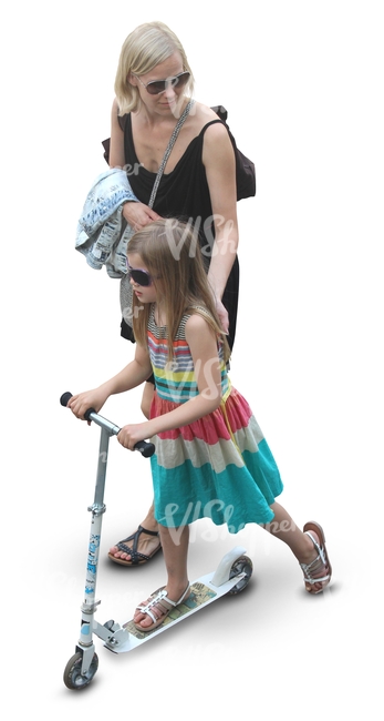 mother with her daughter whos riding a scooter