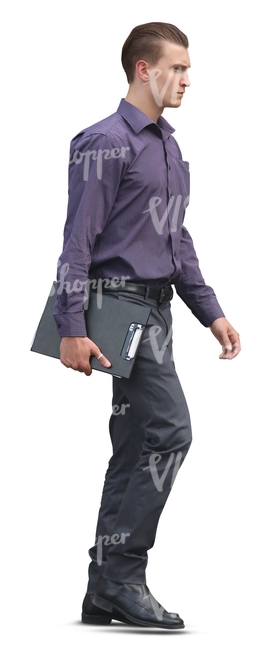 young businessman walking and holding a notepad in his hand