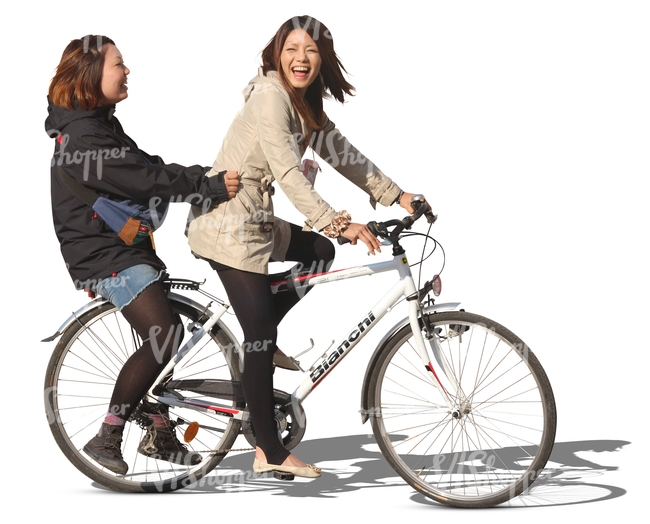 two laughing asian girls riding a bicycle