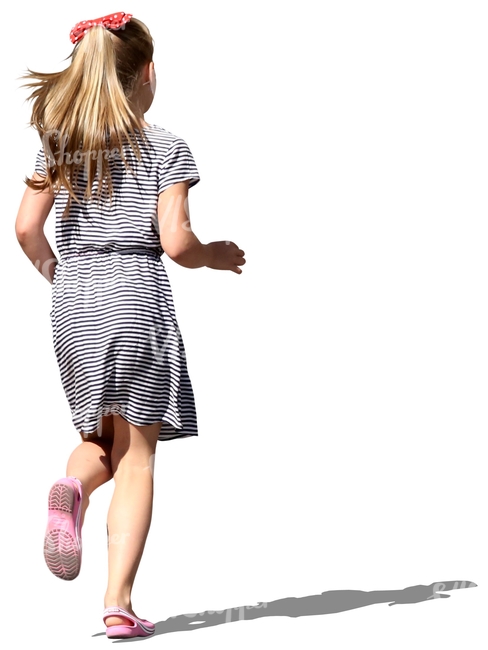 young girl in a striped dress running