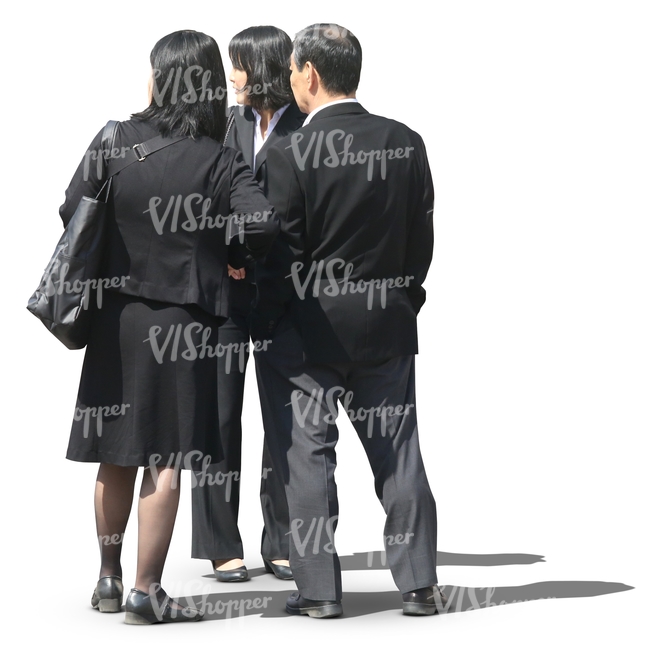 group of asian business people standing and looking at smth