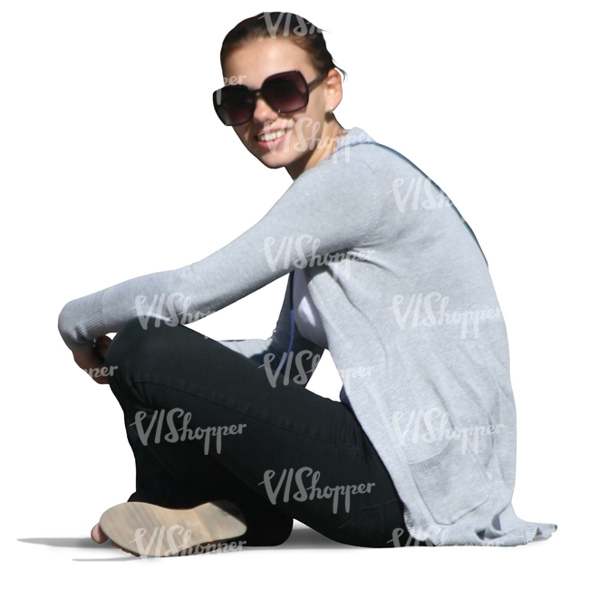 smiling girl sitting on the ground
