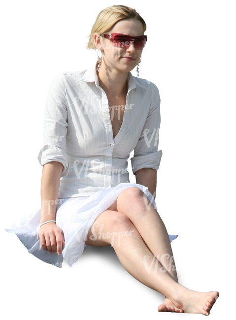 smiling young woman in a white dress sitting