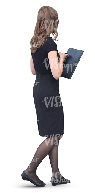 woman in a formal black dress walking