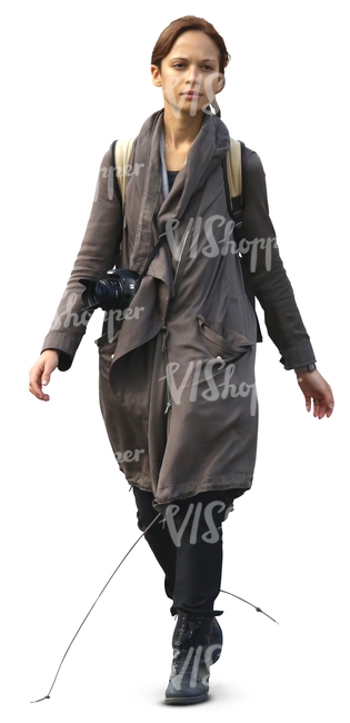 woman in a grey coat walking towards the camera