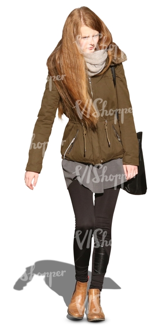 long-haired woman in a khaki parka walking towards the camera