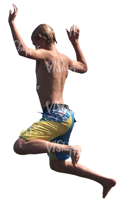 young boy in swimming shorts jumping into the water