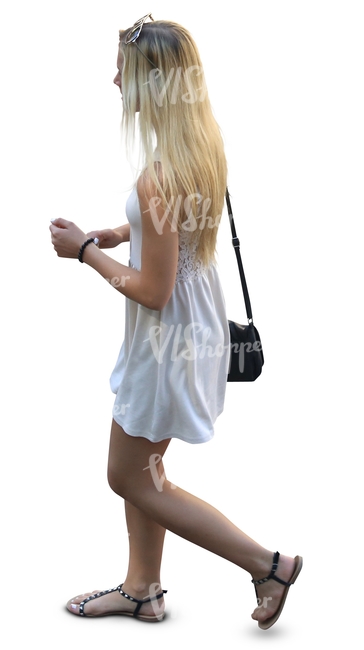 blonde woman in a white summer dress walking