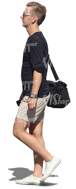 blond man with sunglasses walking and carrying a bag